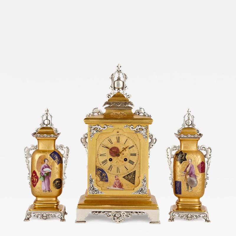  Alex r M Hays Japanese style gilt brass clock set with silvered brass and porcelain mounts