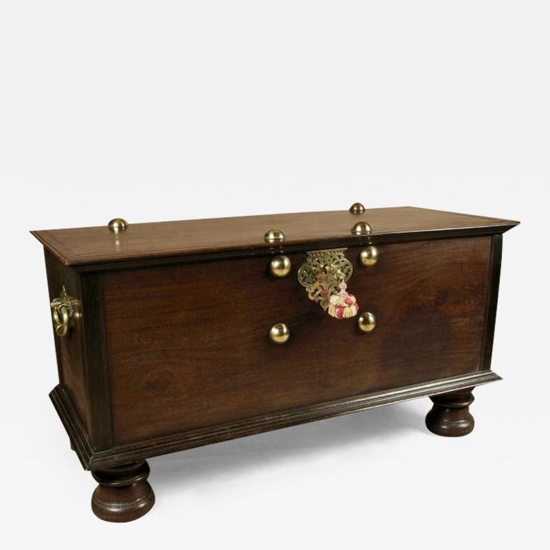  An original and decorative Dutch Colonial Hard wood chest with brass mounts