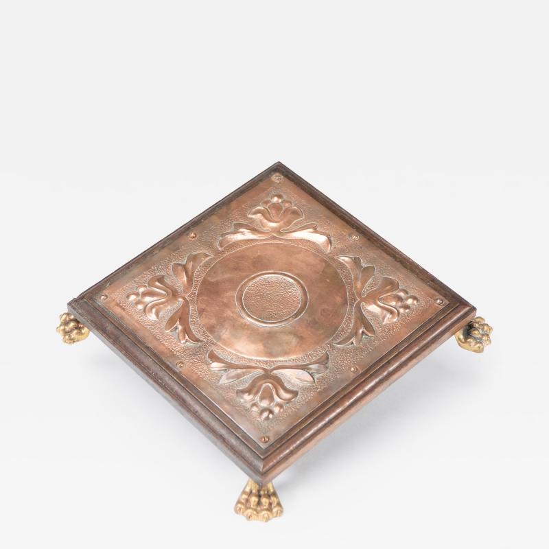  Benham Froud Benham Froud attri An Arts Crafts copper and oak teapot stand or trivet