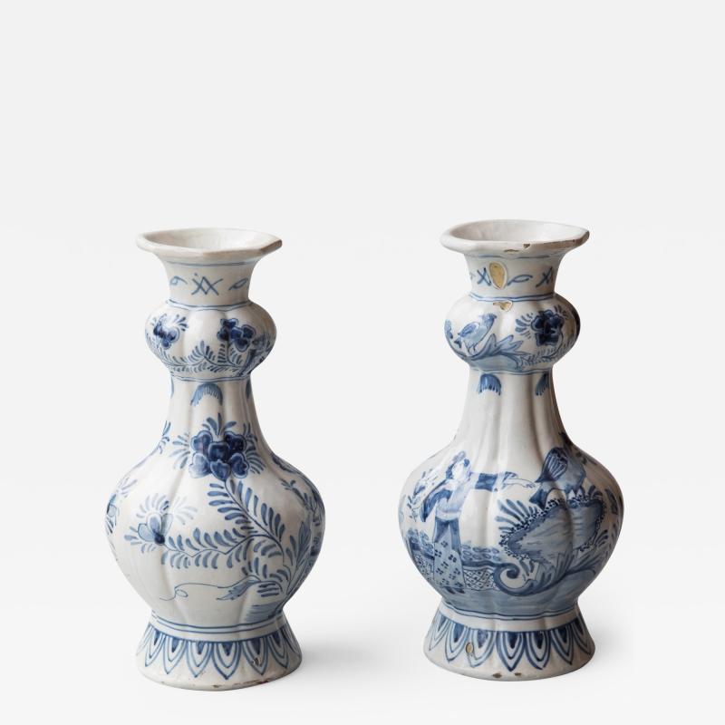  De Porceleyne Schotel A PAIR OF 18TH CENTURY CHINOISERIE DUTCH DELFT BLUE AND WHITE VASES