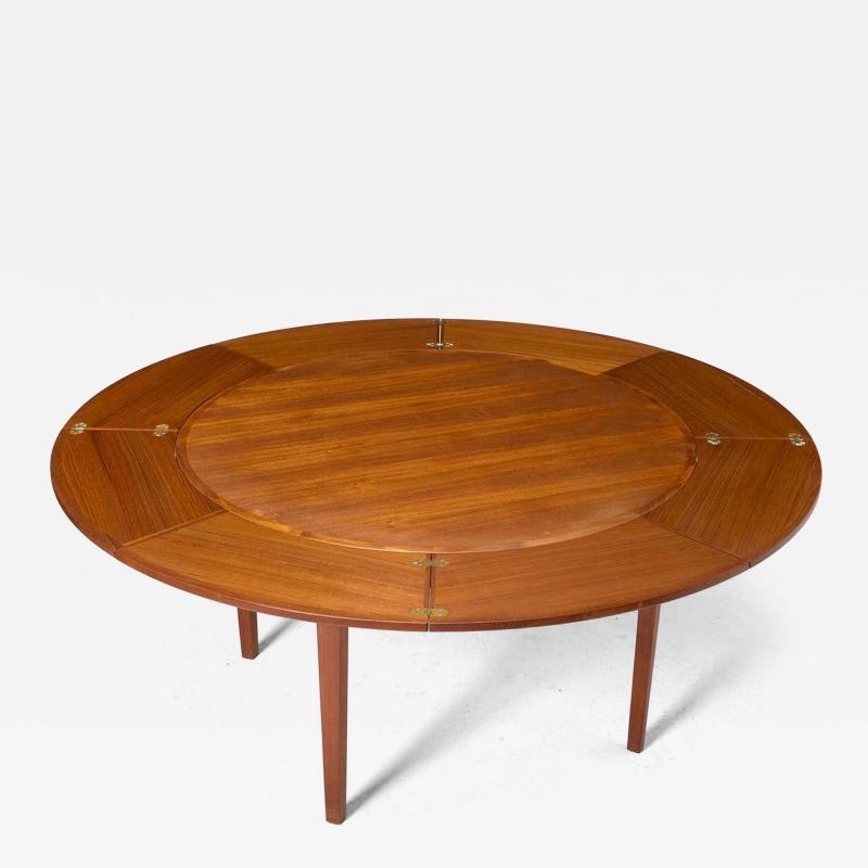  Dyrlund Danish Teak Circular Expanding Flip Flap Dining Table by Dyrlund Furniture