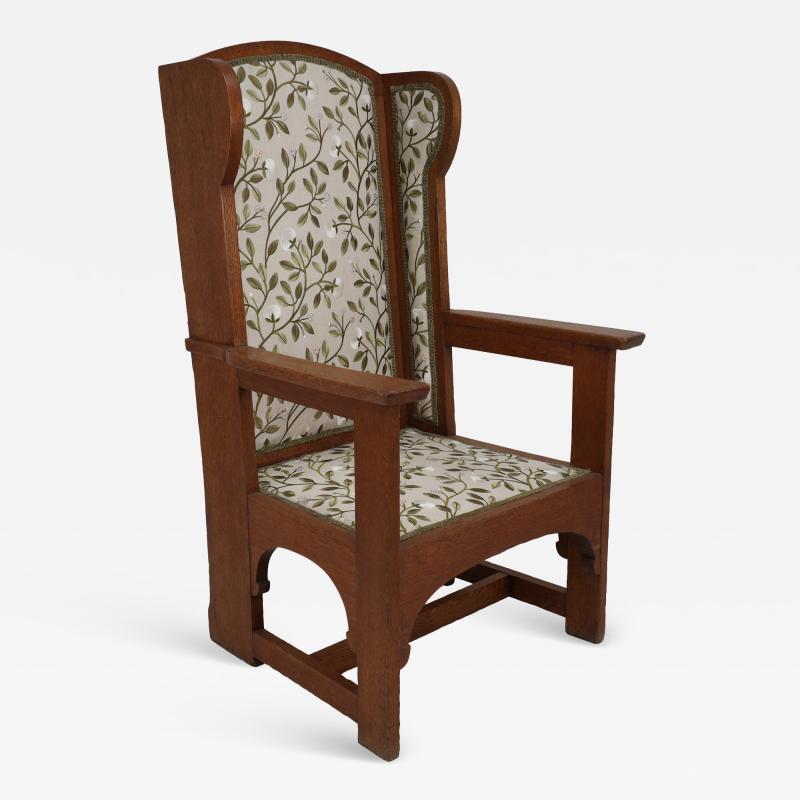  E G Punnett E G Punnet attributed Probably made by William Birch An oak wing back armchair