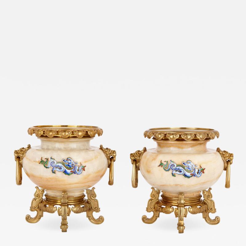  H Journet Cie Two gilt bronze mounted enamelled onyx urns by H Journet Cie