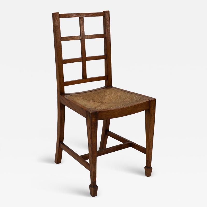  Heal s Heals Heal Son Ltd Heals of London attributed An Arts Crafts Oak Lattice Back Side Chair