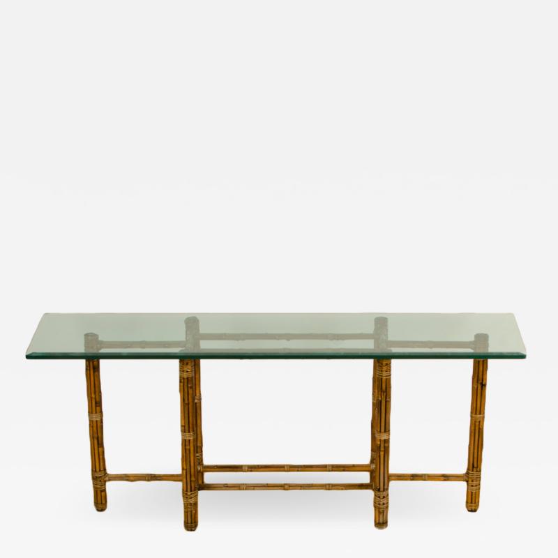  John Elinor McGuire A Mid Century bamboo six leg console table by McGuire with thick glass top