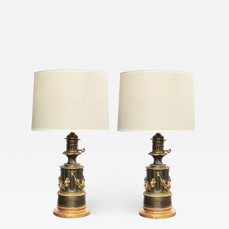  Lampe a Moderateur A rare pair of electrified bronze oil lamps by Lampe a Moderateur Paris