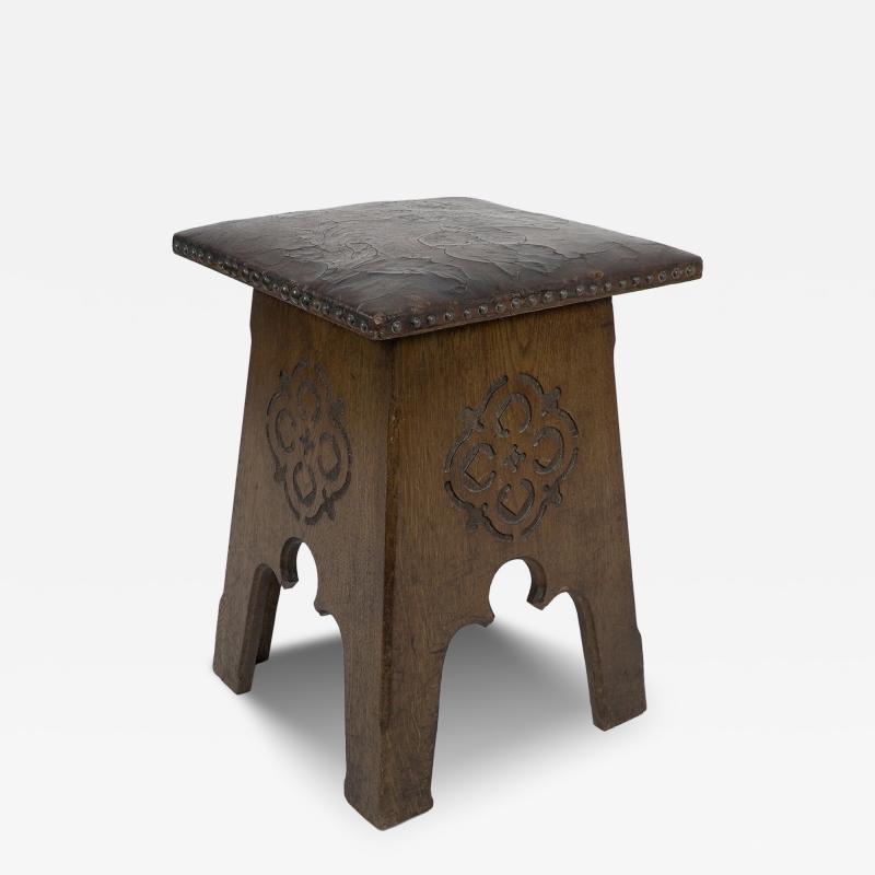  Liberty Co Liberty Co An Arts Crafts Moorish Oak Stool with Embossed Leather Seat
