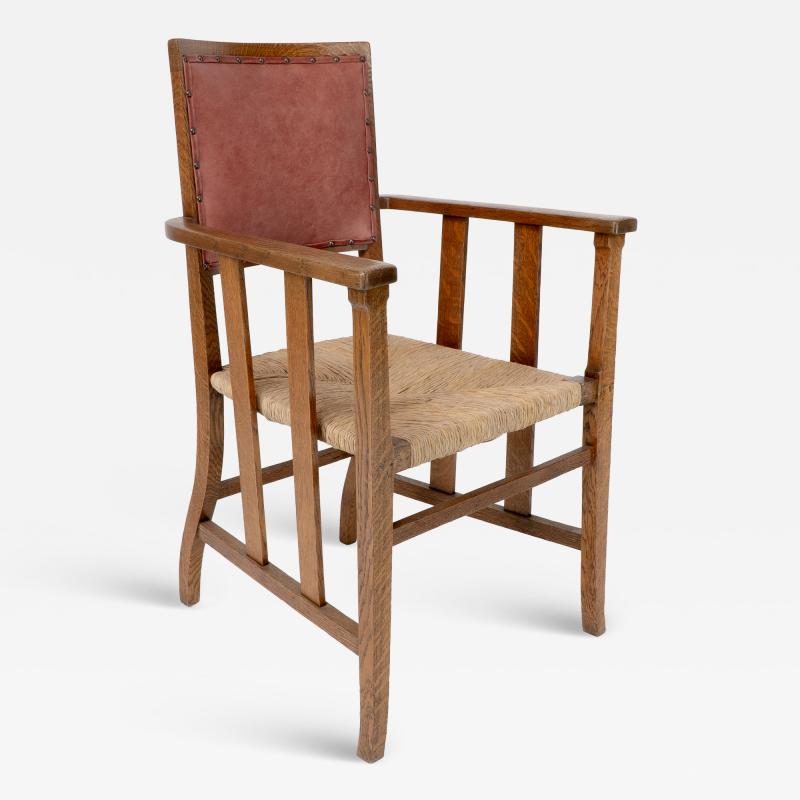  Liberty Co Liberty Co An Arts Crafts Rush Seat Armchair with a Shaped Back