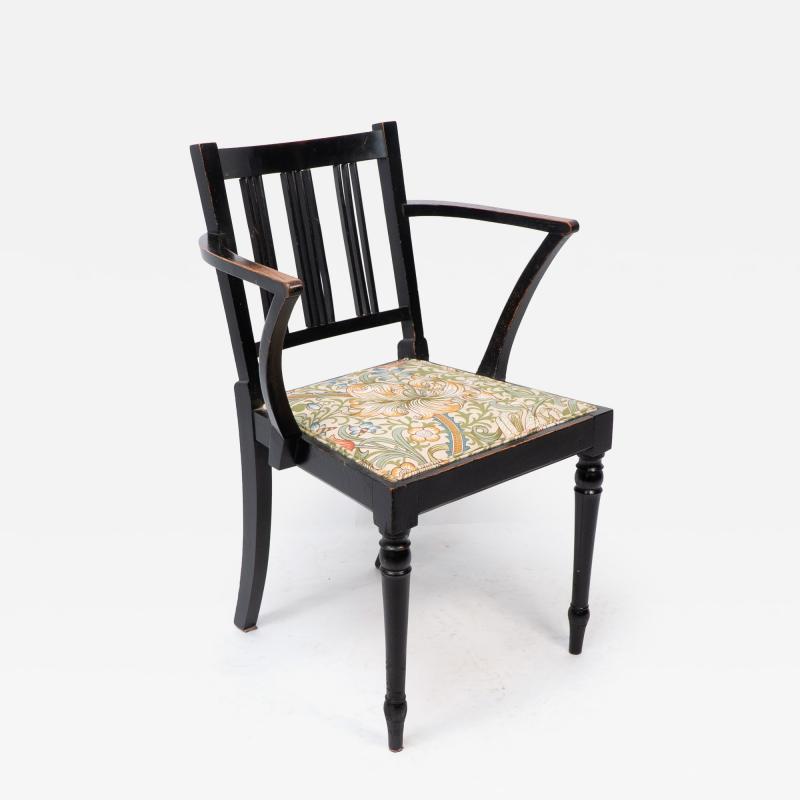  Morris Co Morris Co attributed An Arts Crafts beech armchair with Morris fabric seat 