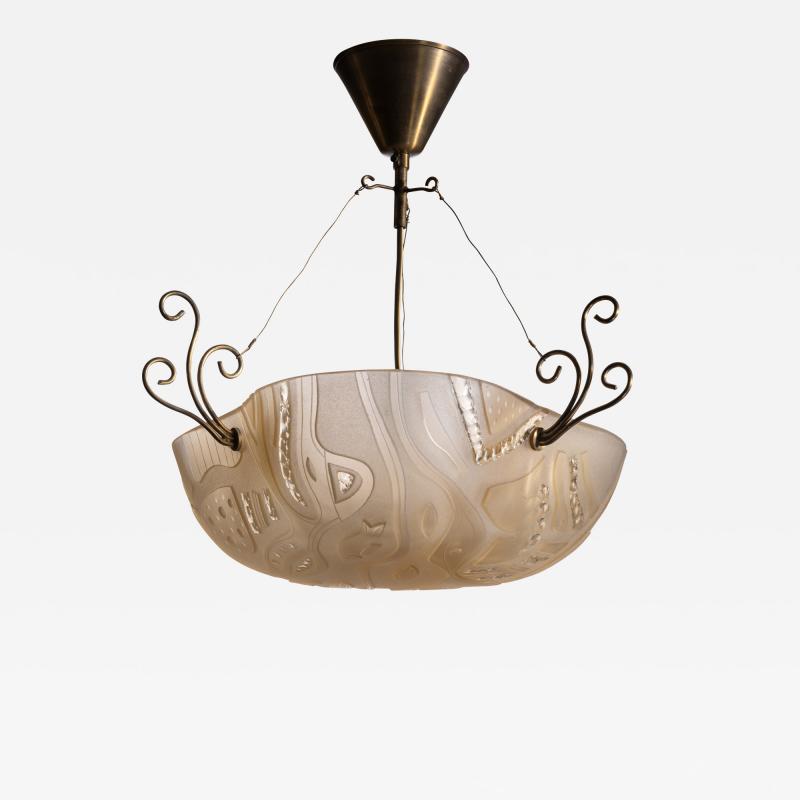  Orrefors Orrefors pendant with decorated glass and scrolled brass elements