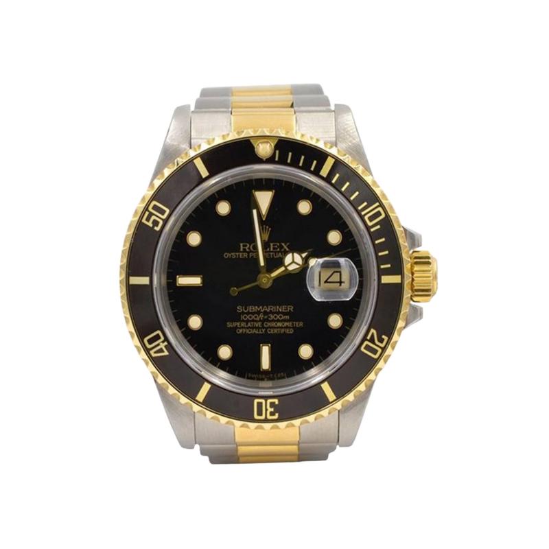  Rolex Watch Co Rolex Two Tone Submariner Wristwatch in 18K Gold and Steel Ref 16803 Circa 1985
