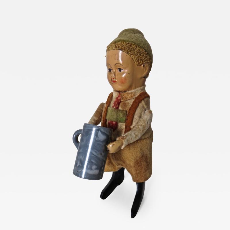  Schuco Company Schuco Clockwork Dancing Boy with a Beer Mug Germany Circa 1940