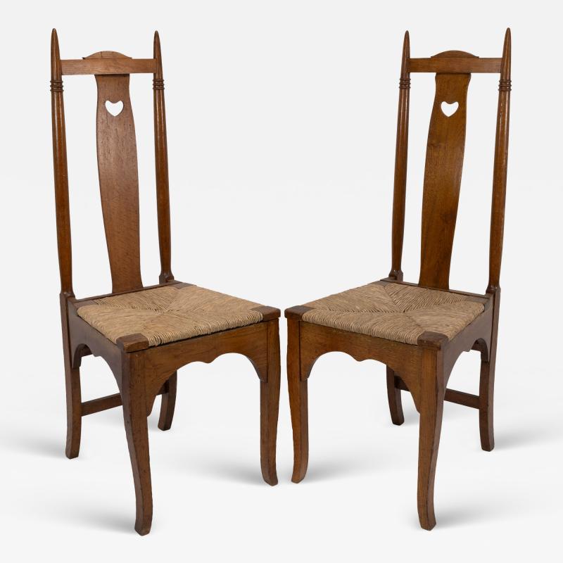 Shapland Petter Shapland Petter a Pair of Arts Crafts Oak Dining Chairs with Pierced Hearts