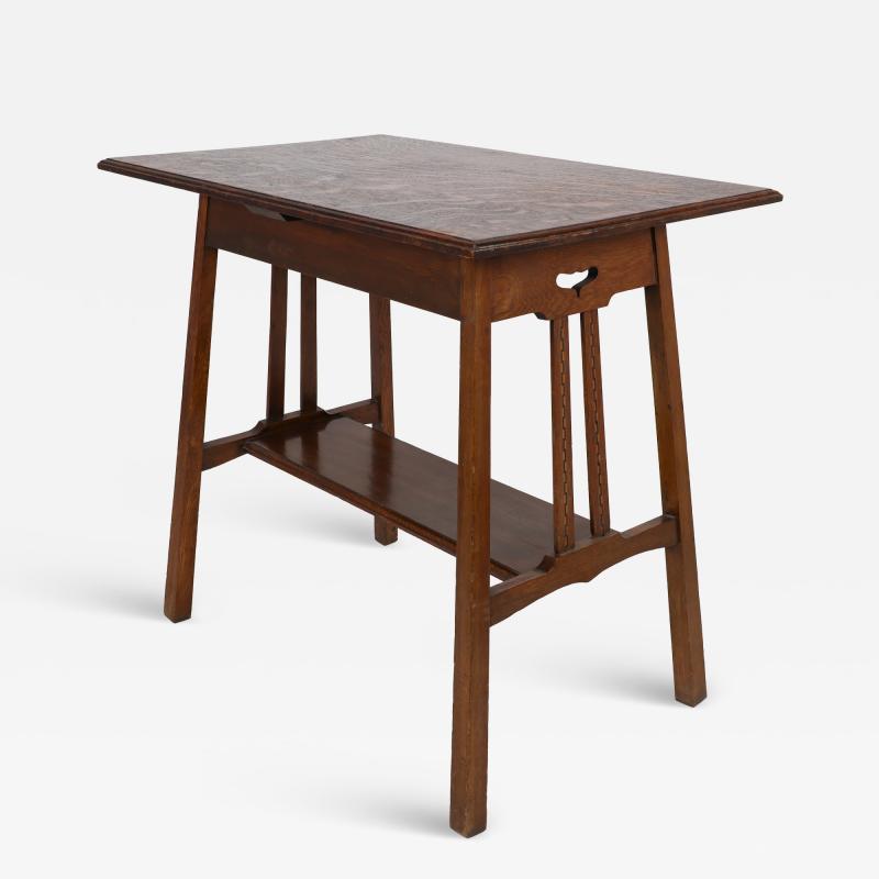  Waring Gillow Arts Crafts side table with oblong chequered inlaid top curved aprons below 