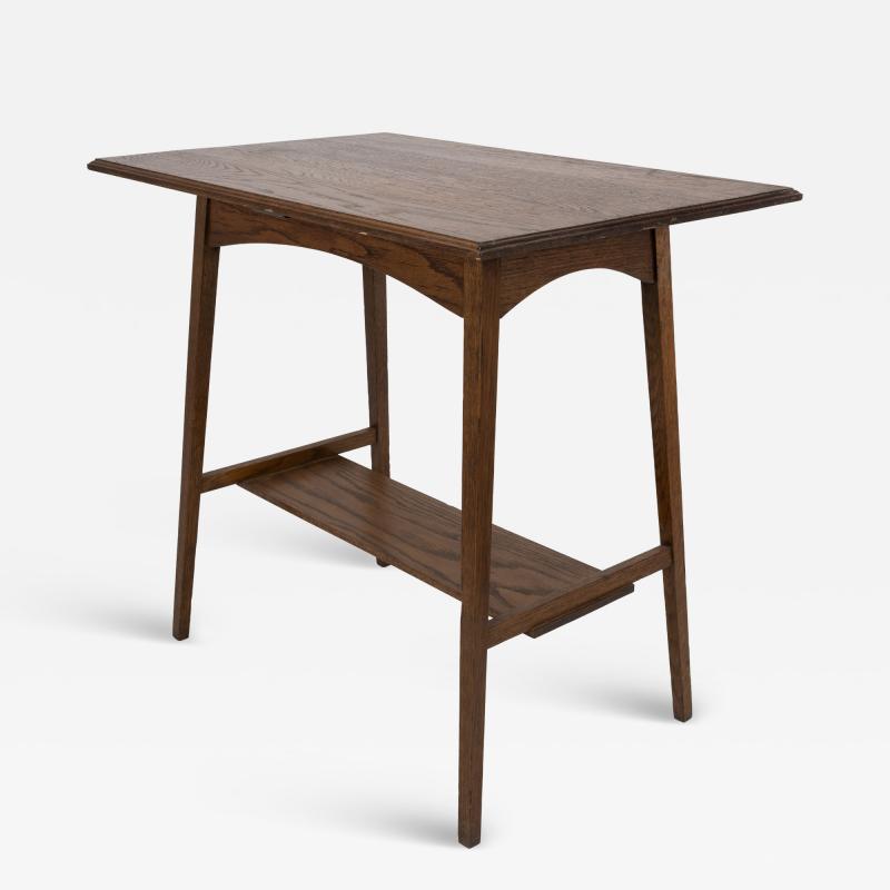  Waring Gillow Waring and Gillows A pair of Arts Crafts oblong side tables with curved aprons