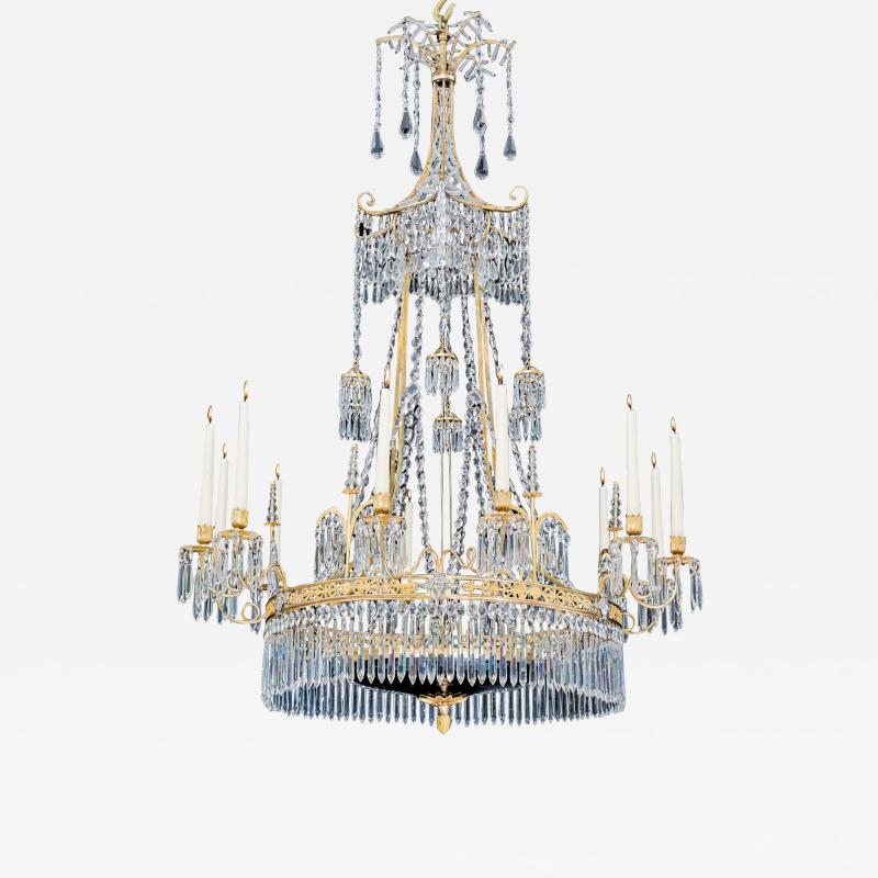  Werner Mieth A GERMAN NEOCLASSICAL SILVER AND GILT BRONZE TWELVE LIGHT CRYSTAL CHANDELIER