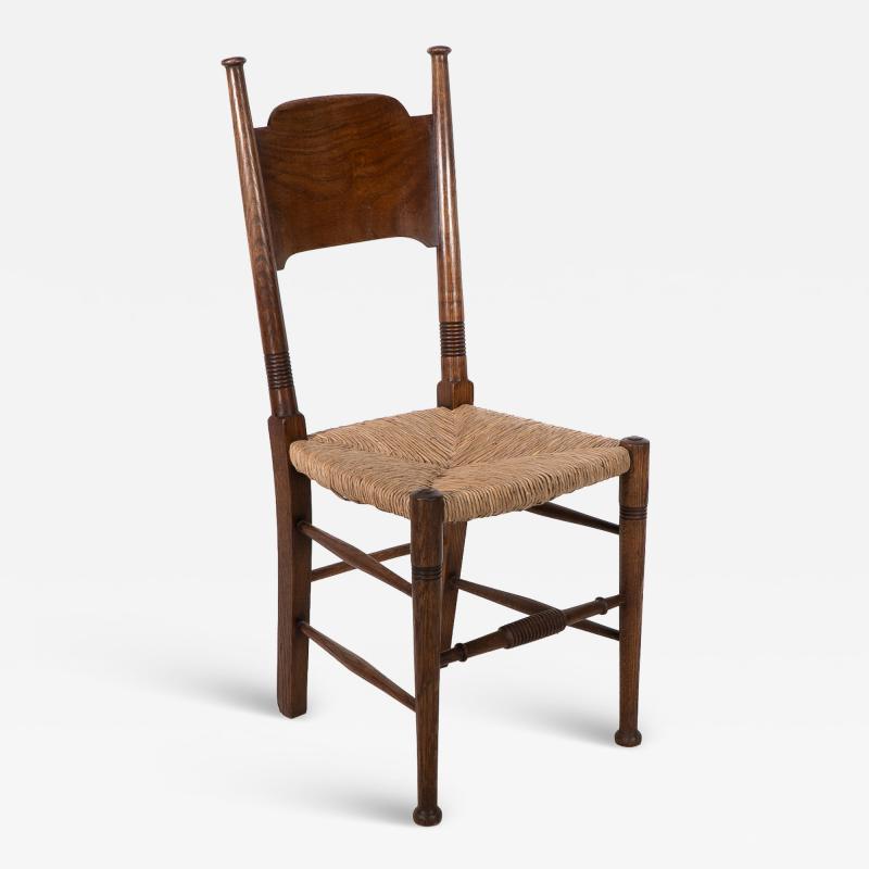  William Birch Ltd William Birch Liberty Co A Arts and Crafts rush seat oak dining chair