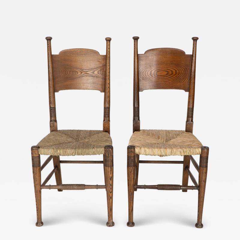  William Birch Ltd William Birch for Liberty Co A Pair of Arts Crafts Rush Seat Oak Chairs