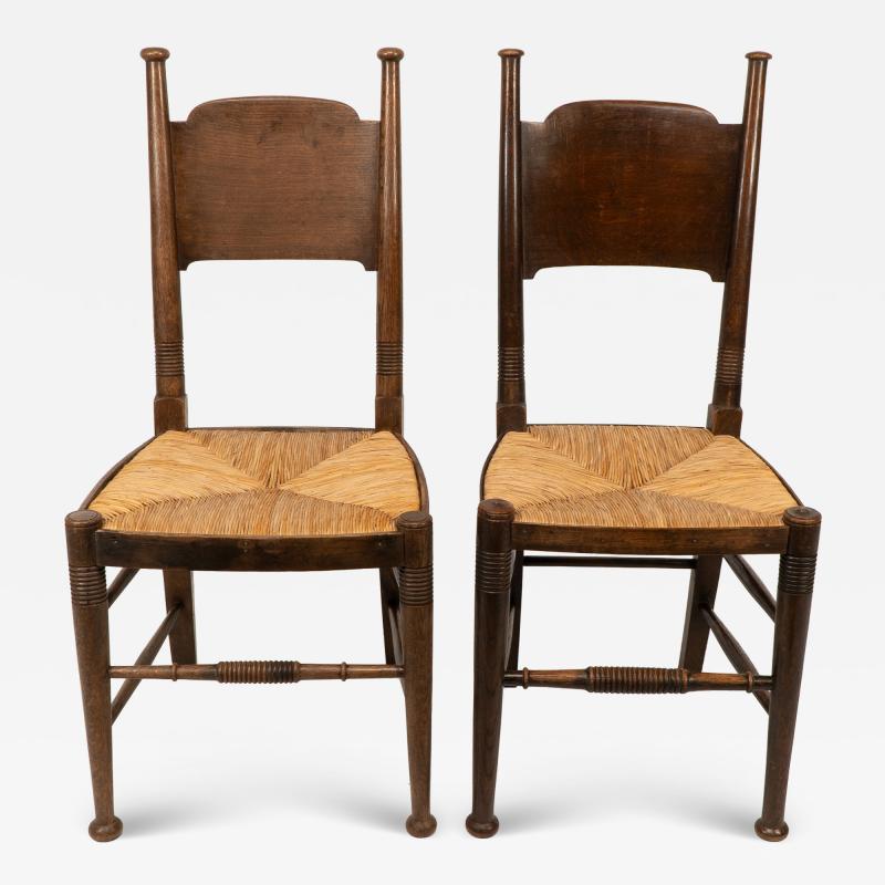  William Birch Ltd William Birch retailed by Liberty Co Pair of Arts Crafts oak dining chairs