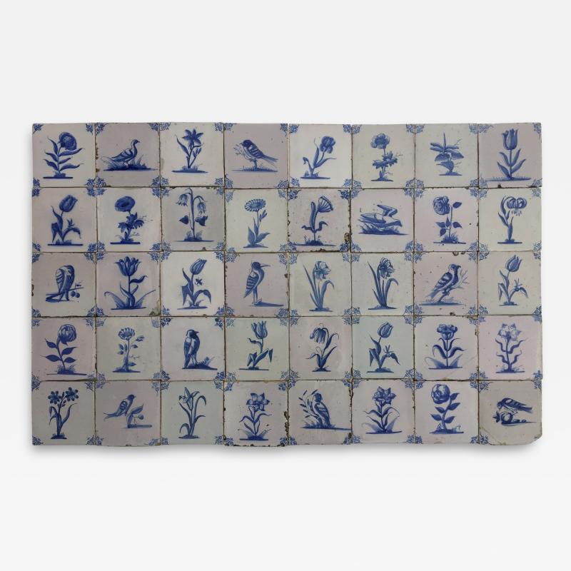 17th century Dutch Delft tiles with flowers and birds backsplash bathroom