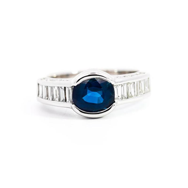 18K White Gold Bezel and Channel Set Oval Cut Blue Sapphire Baguette