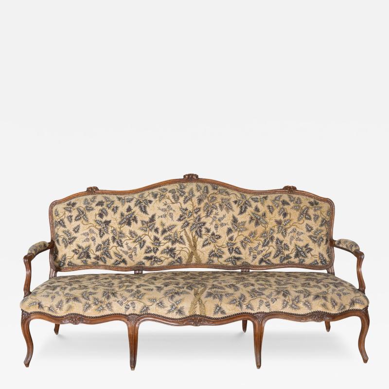 18th Century Louis XV Period Walnut Sofa with Floral Carvings and Tapestry Uphol