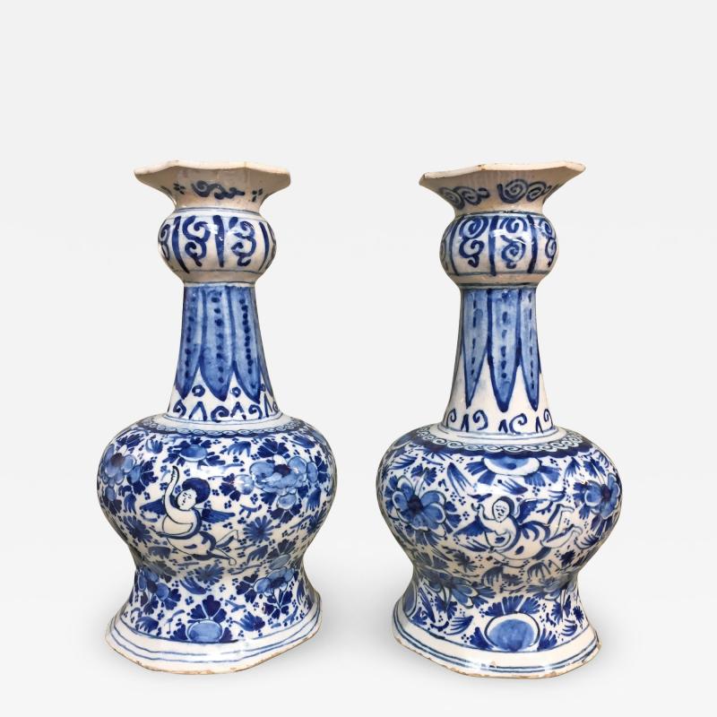 18th century Dutch Delft vases with cupids and flowers
