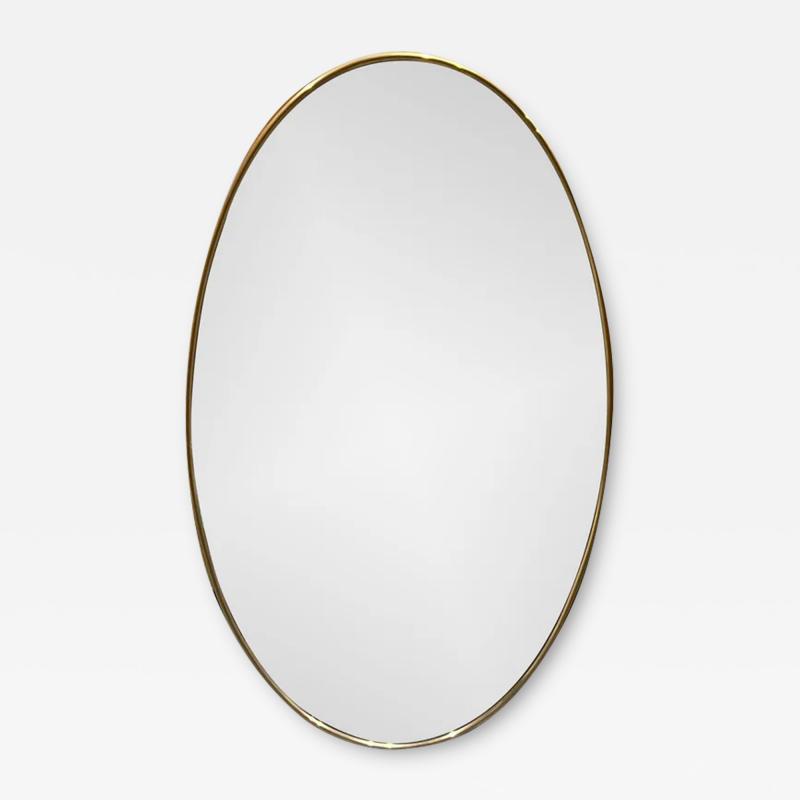 1950S OVAL MIRROR IN AGED BRASS IN THE STYLE OF GIO PONTI