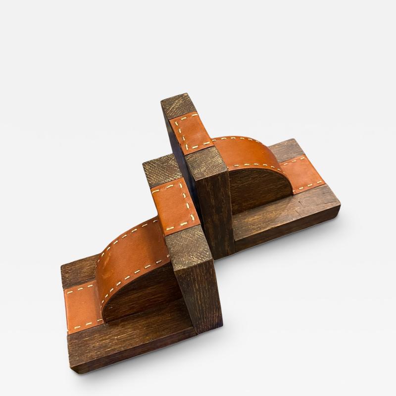 1950s Stitched leather books end by Jacques Adnet