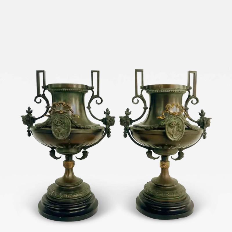 19th Century Bronze Urns with Gilt Cartouches on Stone Bases Pair