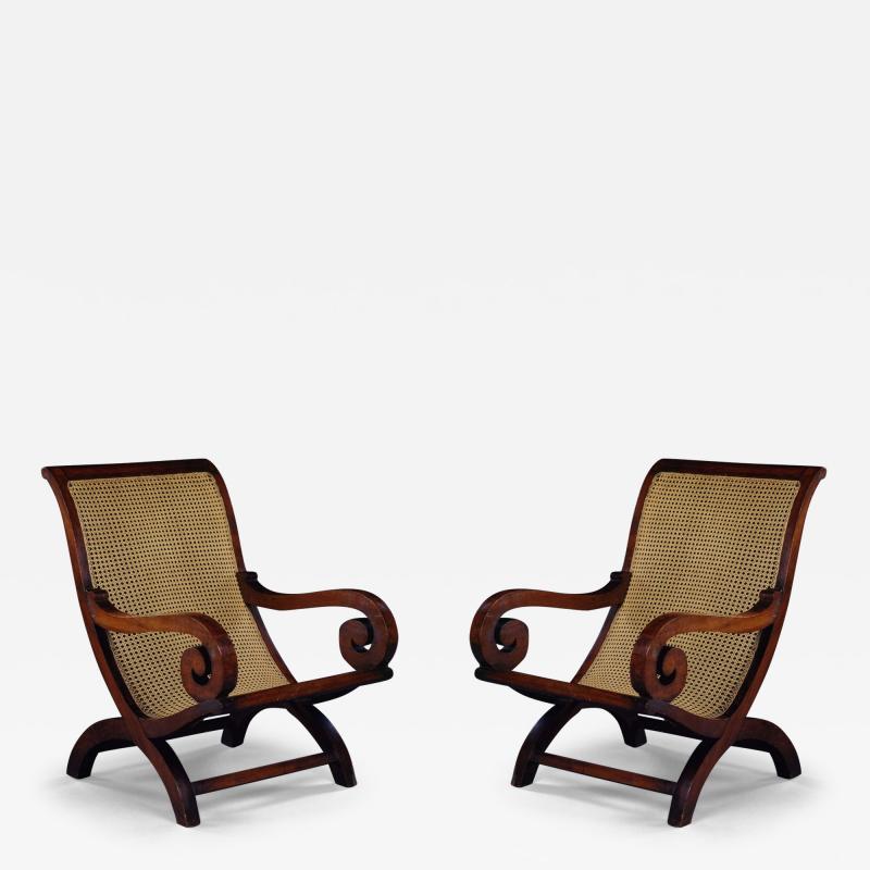 9353 A LARGE PAIR OF POSSIBLY GONCALO ALVES X FORM ARMCHAIRS