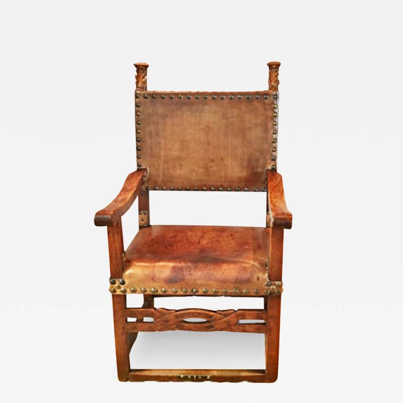 A 17th Century Continental Walnut and Leather Baroque Armchair