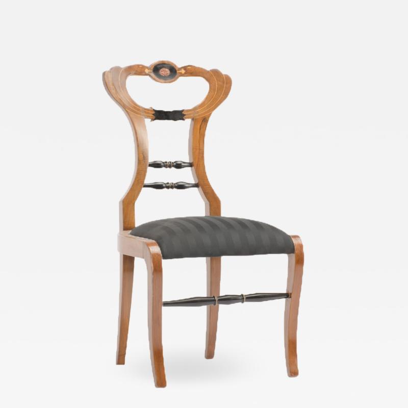 A 19th Century Biedermeier chair upholstered with black striped silk fabric