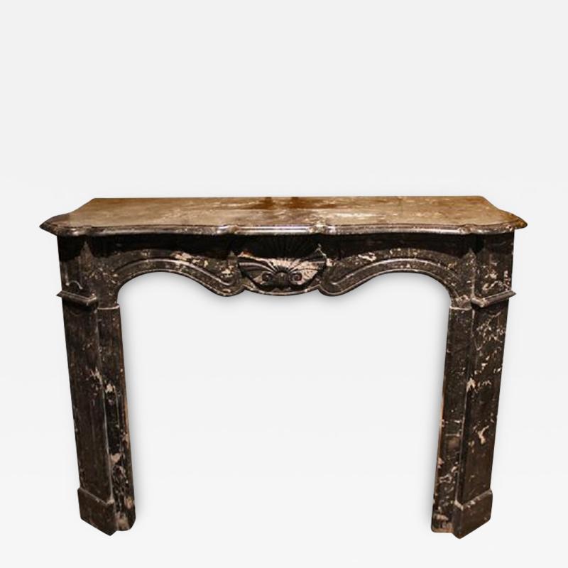 A 19th Century French Louis XV Style Black Marble Fireplace Mantel