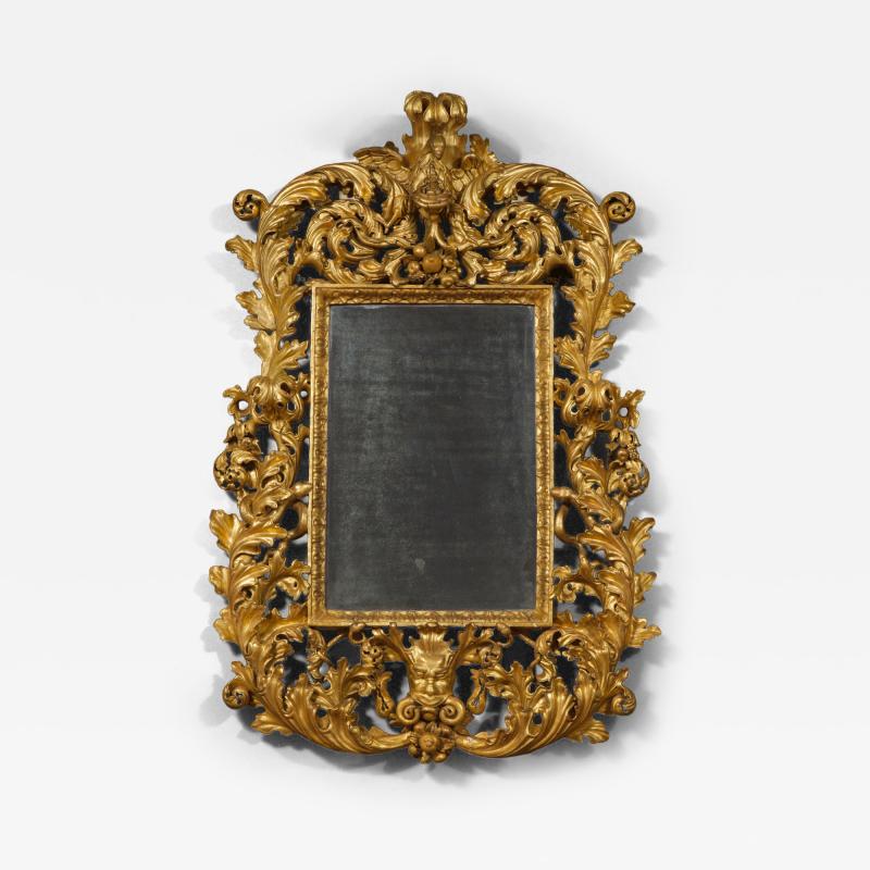 A BAROQUE ACANTHUS GILTWOOD MIRROR CARVED WITH UNUSUAL SERPENT