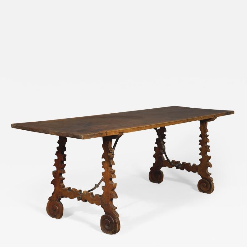 A Baroque Period Trestle Ended And Forged Iron Table
