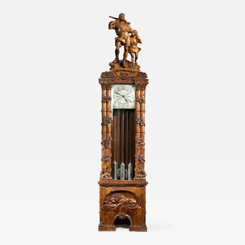 A Black Forest linden wood long case clock by Spring of Interlaken