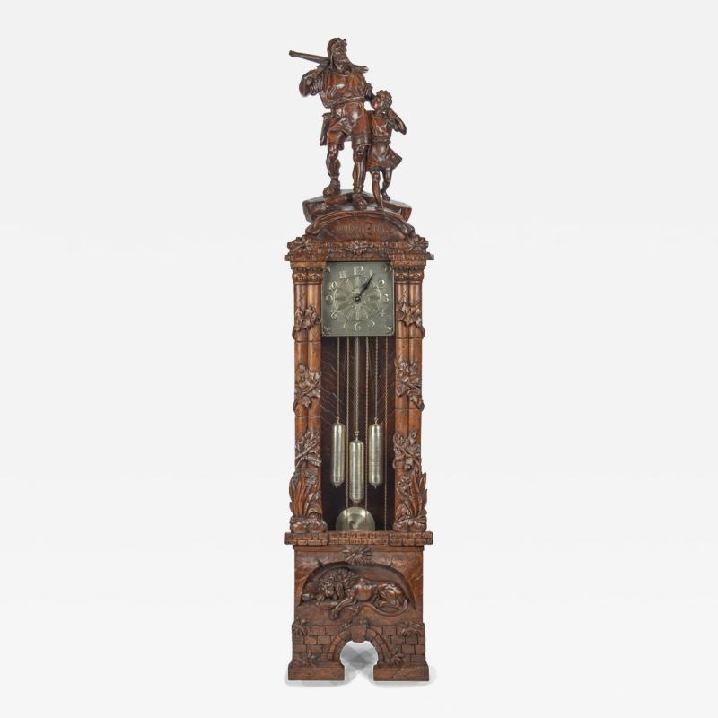 A Black Forest linden wood long case clock by Spring of Interlaken