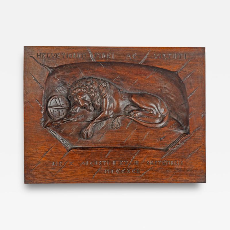 A Black Forest walnut plaque of the Lion of Lucerne 