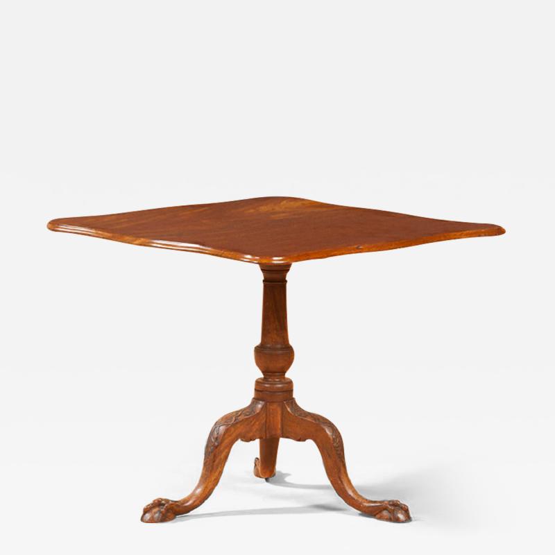 A CHIPPENDALE CARVED MAHOGANY TILT TOP TEA TABLE