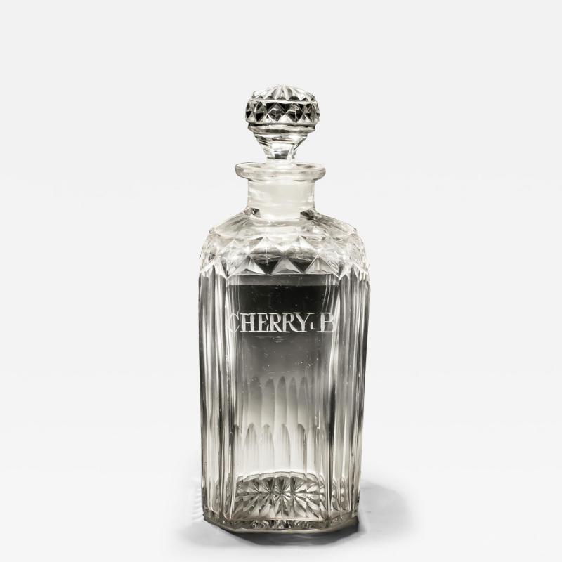 A CUT ENGRAVED LIQUEUR BOTTLE