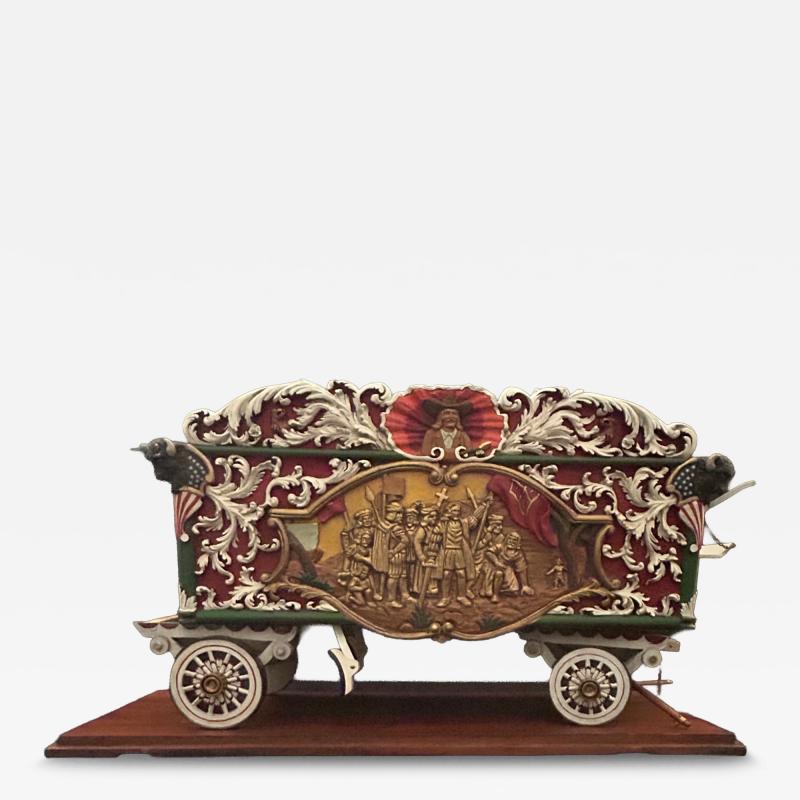 A Carved and Polychrome Paint Decorated Model of a Circus Wagon 