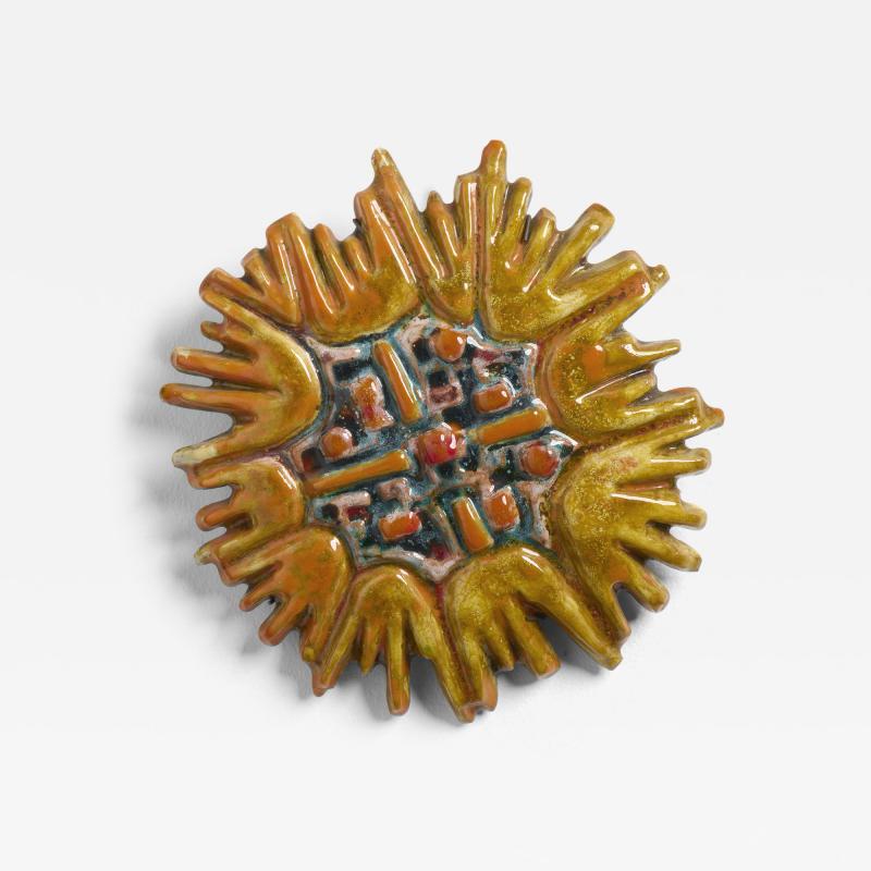 A Ceramic Sun Plaque