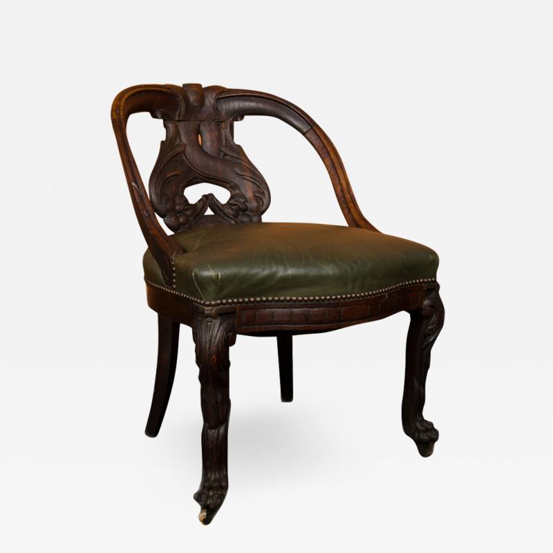 A Chinese carved dragon chair with leather seat 19th C 
