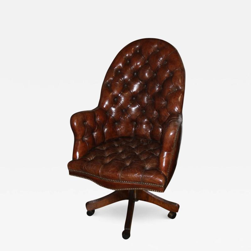 A Classic English Tufted and Adjustable Swivel Desk Chair