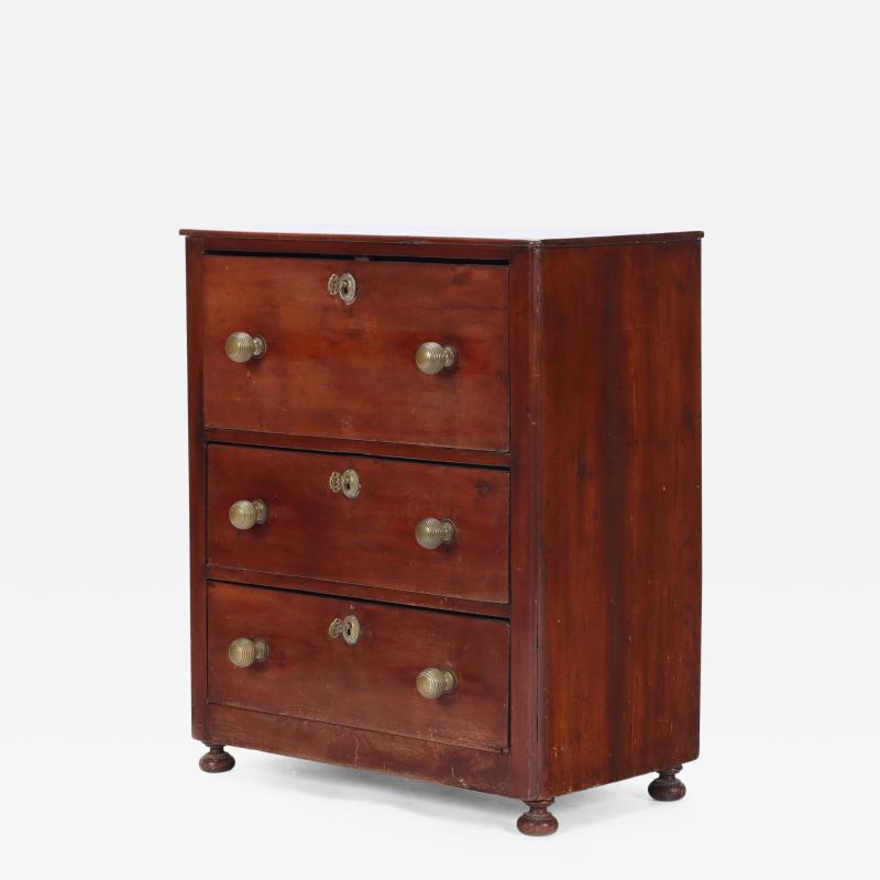 A Continental three Drawer Mahogany Bedside Chest with Bronze Pulls