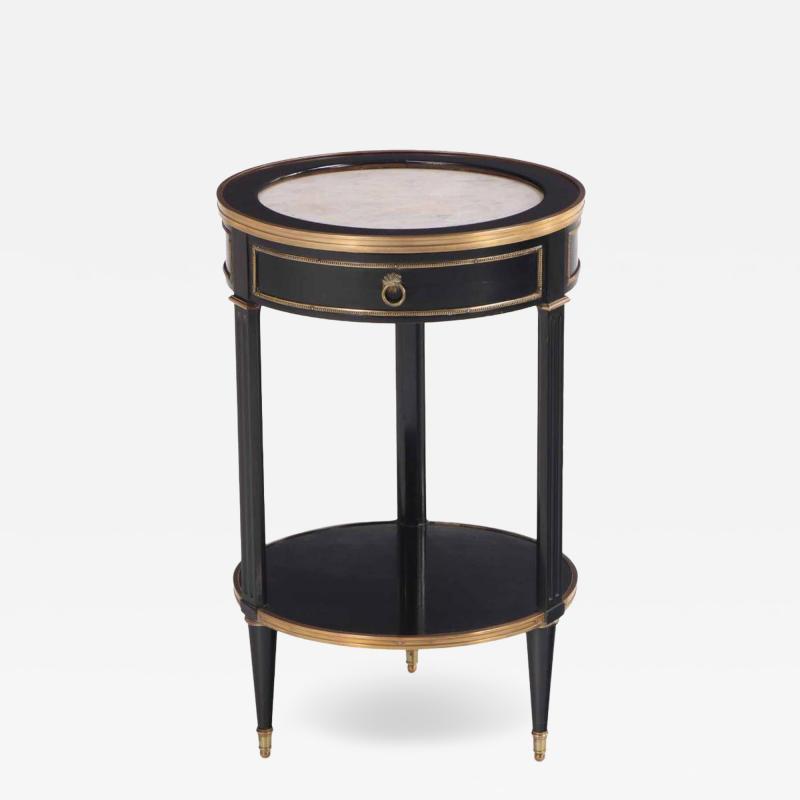 A Directoire style ebonized and bronze mounted marble top table C 1940 
