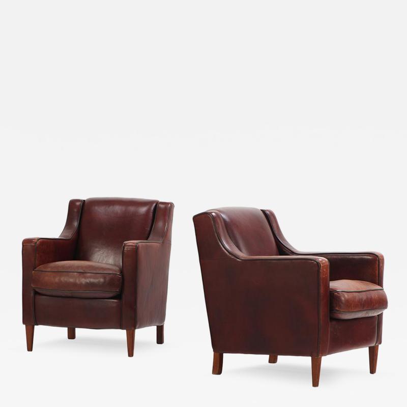 A Dutch pair of leather club chairs C 1960 