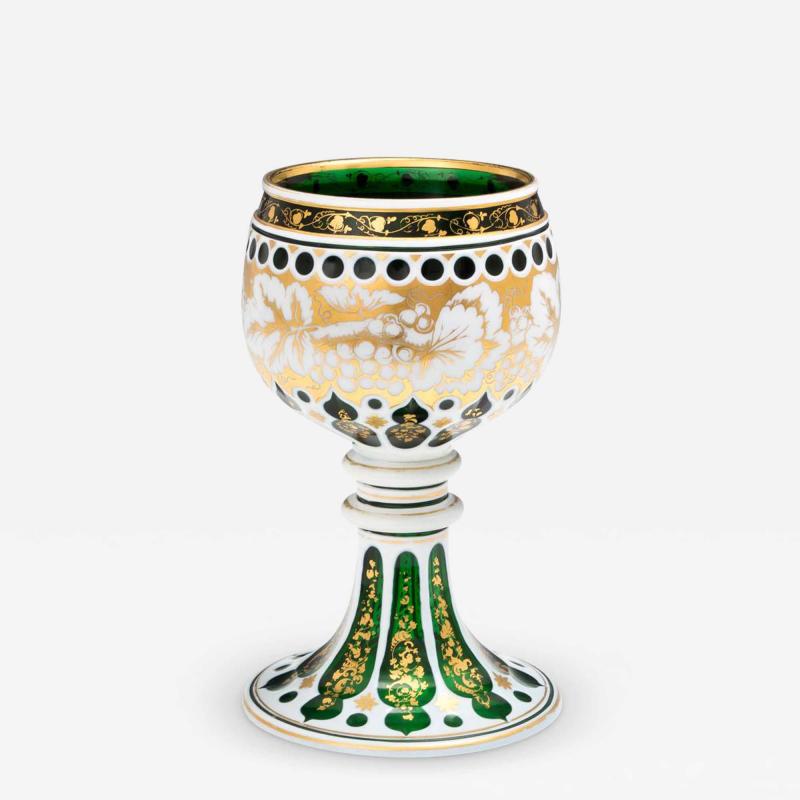 A EMERALD GREEN WHITE OVERLAID GOBLET WITH GILT DECORATION