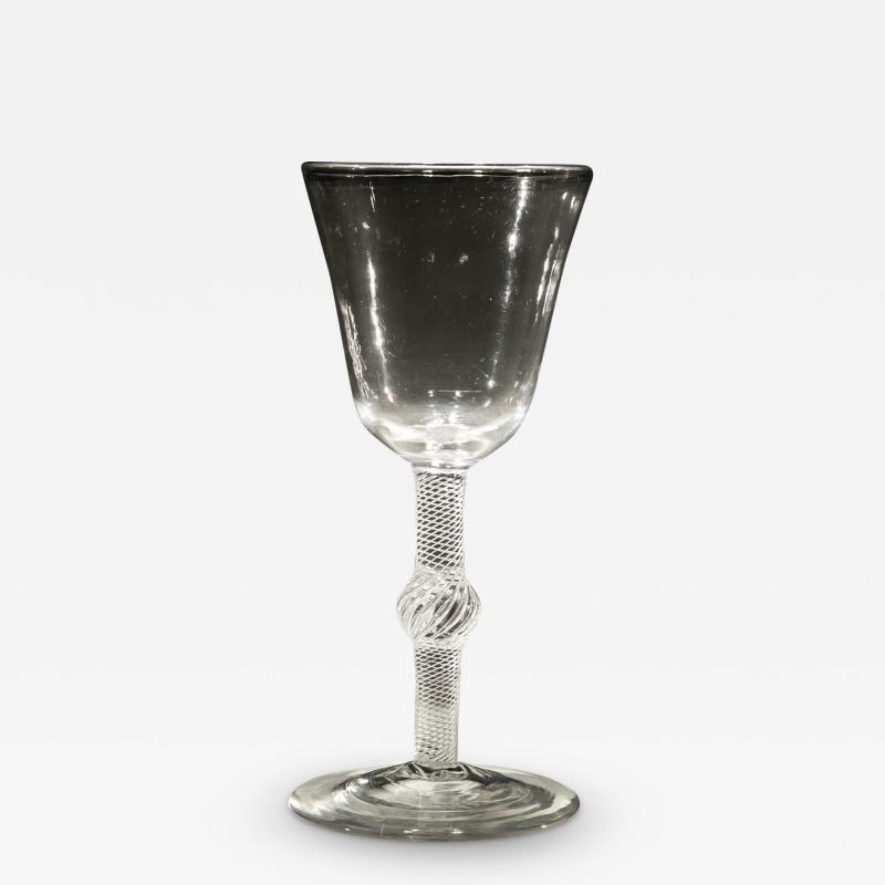 A FINE CENTRAL KNOPPED AIR TWIST GOBLET WITH ROUND FUNNEL BOWL